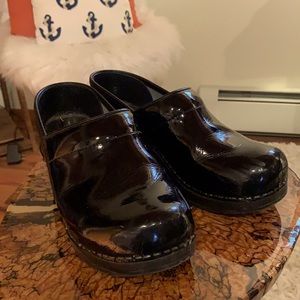 Black patent leather clogs